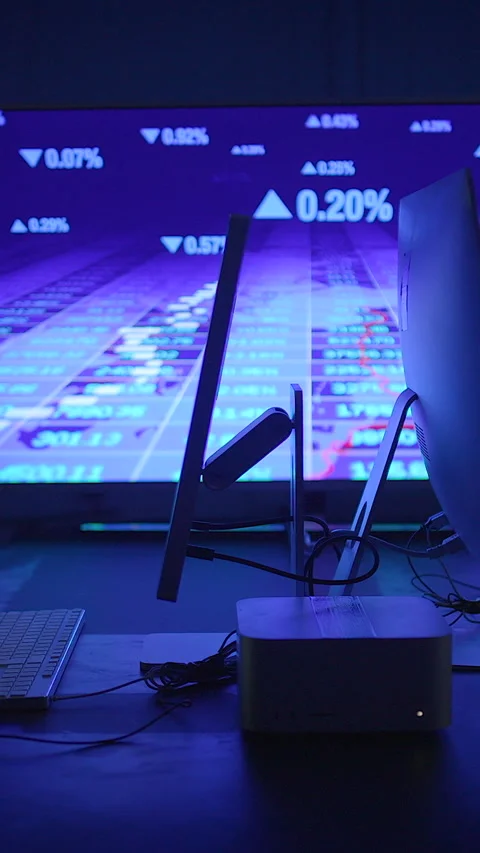 A Modern Computer Setup Featuring a Data Visualization Background for Stock Footage 296017137