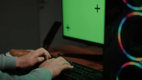 Modern Computer Setup with Green Screen and RGB Gaming PC Stock Footage 306424435