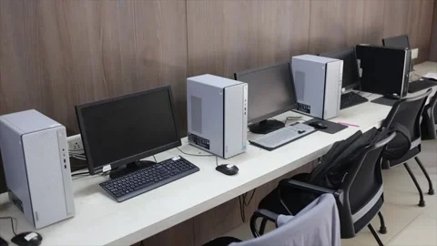 Modern Computer Training Lab with Rows of Desktop Workstations Monitors and Stock Footage 333605446