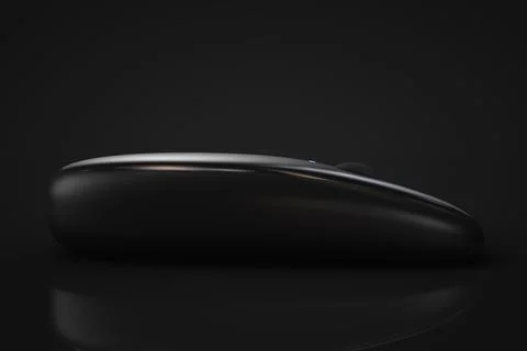 Modern computer wireless mouse. Close-up. Dark style. Stock-Fotos