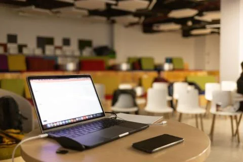 Modern computer,laptop with blank screen on table with blur cafe,restaurant Stock Photos