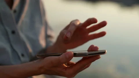 The modern concept of the wireless technology user. Close-up of women hands 動画素材 157256846