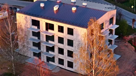Modern concrete apartment building under construction at sunset aerial view Stock Footage 336307181
