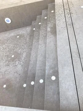 Modern concrete pool steps with integrated lighting 스톡 사진