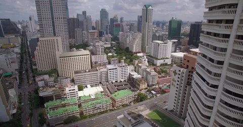 Modern Condominium Tower Block And Bangkok Cityscape, Aerial Slider Reveal Shot Video stock 80296185