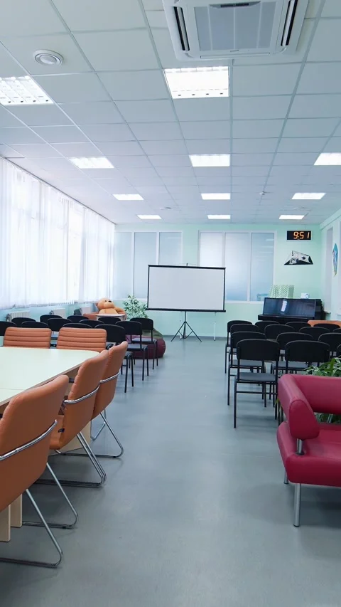 Modern conference room interior with presentation screen and rows of chairs.. Stock Footage 337634673