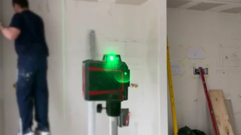 Modern construction laser level  on construction site for  precise measuring, 스톡 동영상 155245048