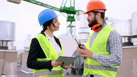 Modern construction site on the top of the building charismatic woman engineer Stock Footage 138203536