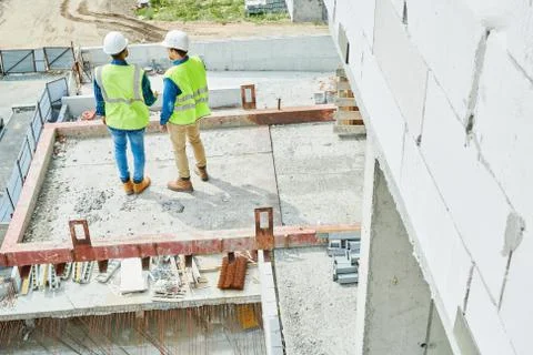Modern constructors working on new house Stock Photos