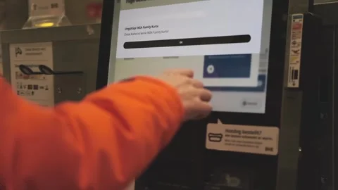 Modern consumer scanning qr code on self-checkout screen to add ikea card i.. Stock Footage 321833622