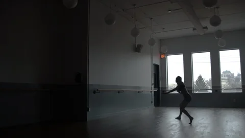 Modern contemporary dancer dancing in large minimal dance studio 스톡 동영상 104272130