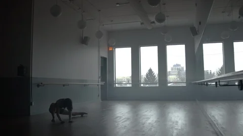 Modern contemporary dancer dancing in large minimal dance studio 스톡 동영상 104272413