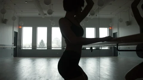 Modern contemporary dancer freestyle dancing in front of dance hand rail Stock Footage 104269983