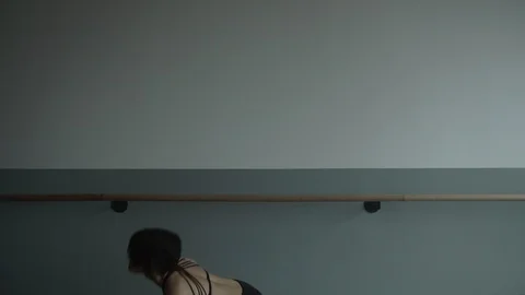 Modern contemporary dancer freestyle dancing in front of dance hand rail Stock Footage 104270206