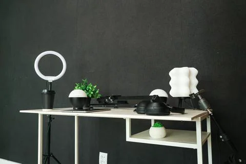 Modern content creation setup with ring light, microphone, and plants Stock Photos