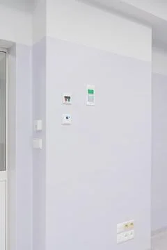 Modern Control Panels and Electrical Outlets on a hospital Wall Stock Photos
