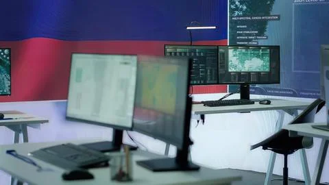 Modern control room with multiple computer monitors Stock Photos