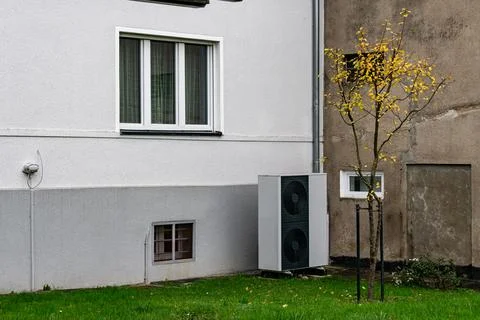 Modern cooling system installed next to a residential building Stock Photos
