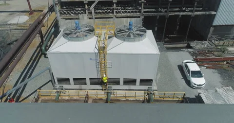 Modern cooling tower close-up. An engineer at a modern cooling tower. Modern Видео 166966372