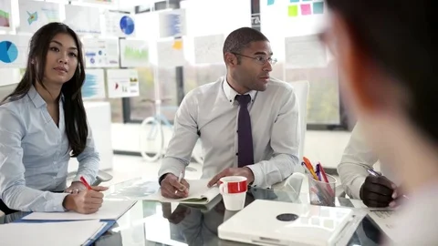 Modern corporate office workers discussing project over boardroom table Stock-Footage 80914682