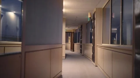 Modern corridor in an establishment with warm lighting and sophisticated desi Vídeos de archivo 329912486