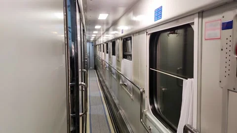 Modern corridor of a train compartment car at night. Rocking in the carriage Stock Footage 295602959