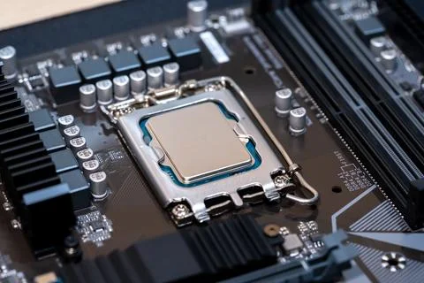 Modern CPU processor installed on a brand new motherboard, object detail, e.. 스톡 사진