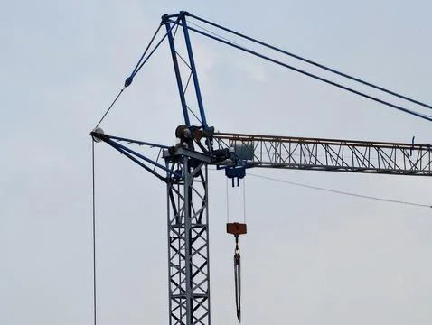 Modern Crane Under Cloudy Sky Viewed. Construction Site With Crane Silhouet.. Foto stock