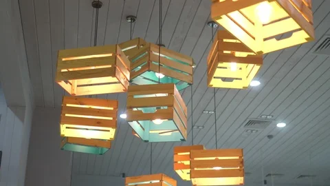 Modern creative ceiling chandeliers in the interior of wooden drawers with light Stock Footage 118403437