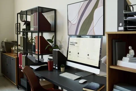 Modern Creative Studio Workspace with Computer Displaying Brand Design Stock Photos