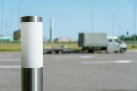 A modern cylindrical lamppost. the lighting system of the gas station terri.. Stock Photos