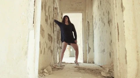 Modern dancer in an abandoned building corridor Stock Footage 81266087