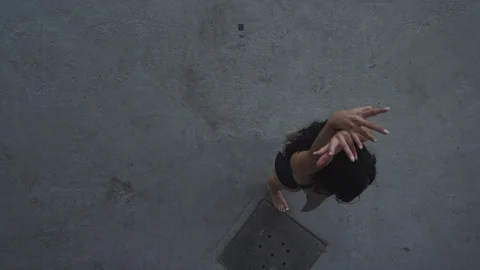 Modern dancer dances with passion in industrial warehouse 動画素材 104417031