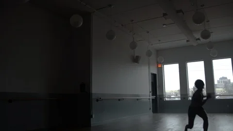 Modern dancer dancing in large minimal dance studio 스톡 동영상 104272927