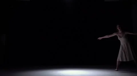 Modern dancer girl in white dress dancing contemporary, jumps on black, shadow Stock Footage