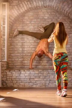 Modern dancer having performance while girl takes photo Stock Photos