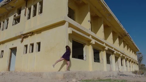 Modern dancer outside an abandoned building Stock Footage 81247500