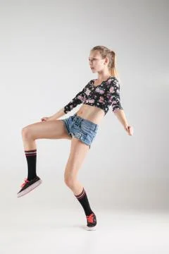 Modern dancer poses in front of studio background Stock Photos
