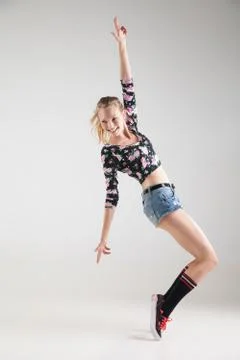 Modern dancer poses in front of studio background Stock Photos