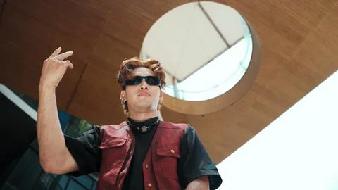 Modern dancer posing at camera with confident with low angle camera. Endeavor. 写真素材