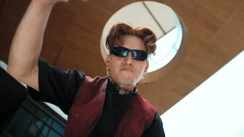 Modern dancer posing at camera with confident with low angle camera. Endeavor. 库存照片