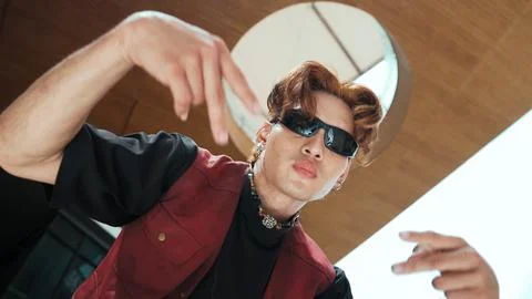 Modern dancer posing at camera with confident with low angle camera. Endeavor. Stockfoto's