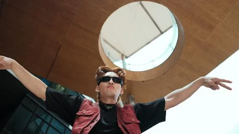 Modern dancer posing at camera with confident with low angle camera. Endeavor. 스톡 사진