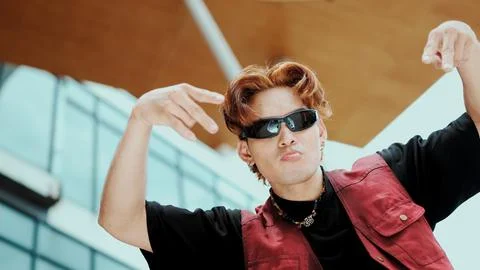 Modern dancer posing at camera with confident with low angle camera. Endeavor. 스톡 사진