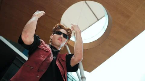 Modern dancer posing at camera with confident with low angle camera. Endeavor. 库存照片