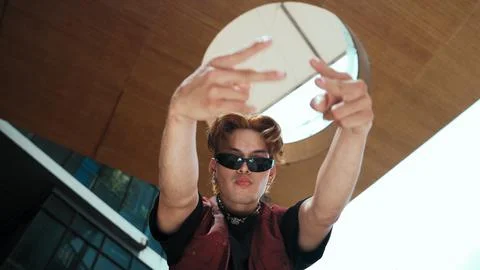 Modern dancer posing at camera with confident with low angle camera. Endeavor. Stockfoto's