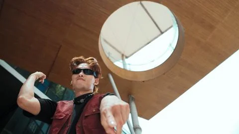 Modern dancer posing at camera with confident with low angle camera. Endeavor. 库存照片