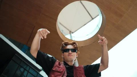 Modern dancer posing at camera with confident with low angle camera. Endeavor. 库存照片