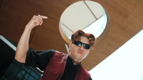 Modern dancer posing at camera with confident with low angle camera. Endeavor. 写真素材