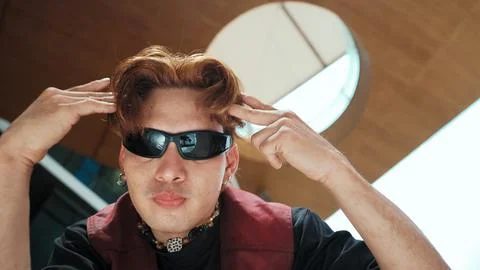 Modern dancer posing at camera with confident with low angle camera. Hiphop. 写真素材